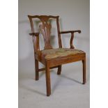 An C18th elm Chippendale style elbow chair, with pierced back splat and scrolled arms, and drop in