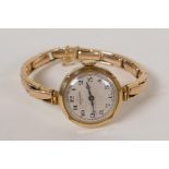 A 9ct gold Tavannes wristwatch with 9ct gold strap and Swiss movement, 21.7g gross