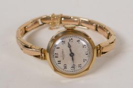 A 9ct gold Tavannes wristwatch with 9ct gold strap and Swiss movement, 21.7g gross