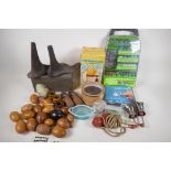 A quantity of miscellaneous items including iron shoe lasts, rotary tool set, wooden eggs, carved