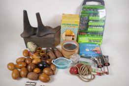 A quantity of miscellaneous items including iron shoe lasts, rotary tool set, wooden eggs, carved