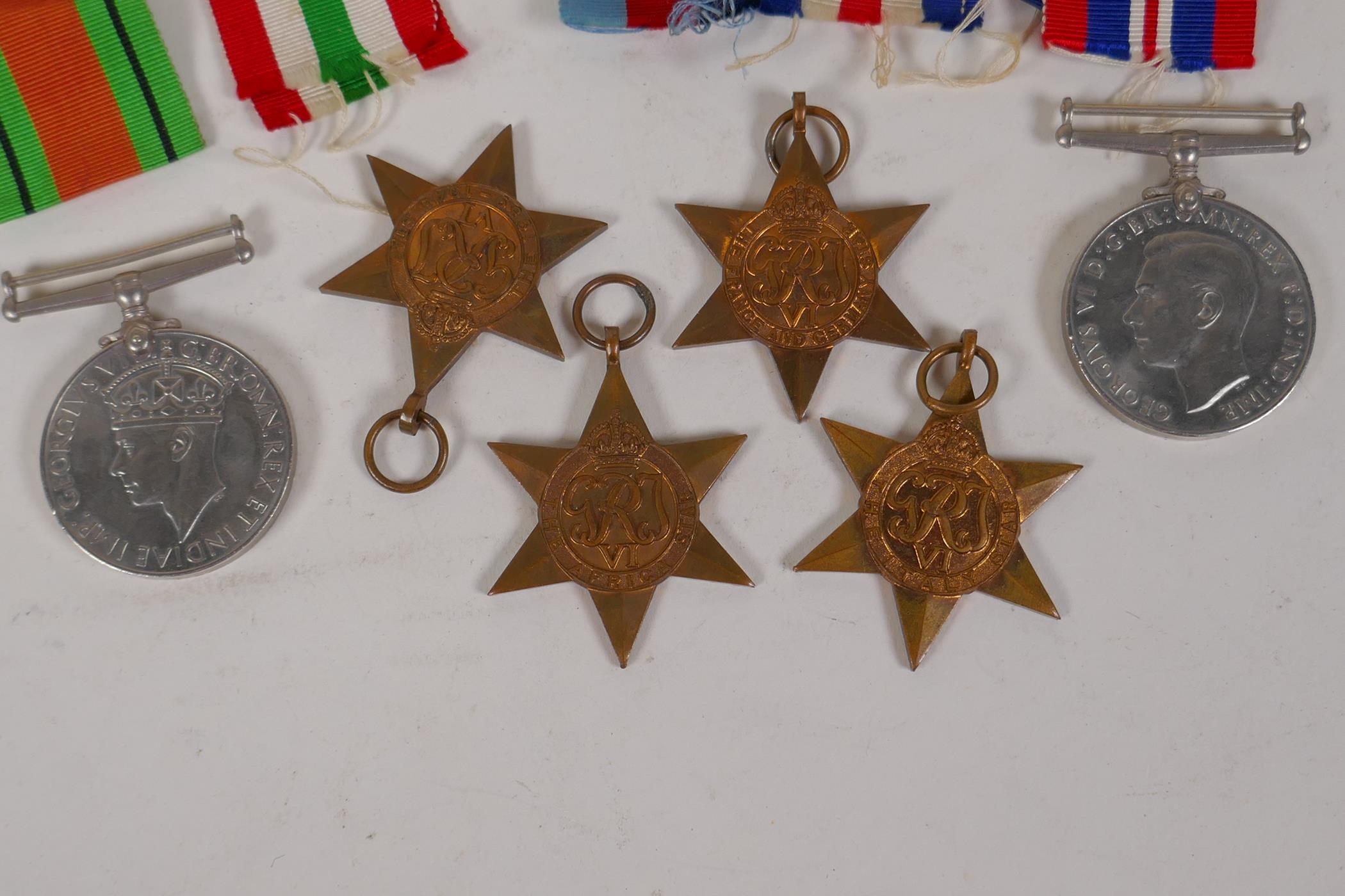 A collection of WWII medals and ribbons, and a Royal Engineers cap badge - Image 3 of 4