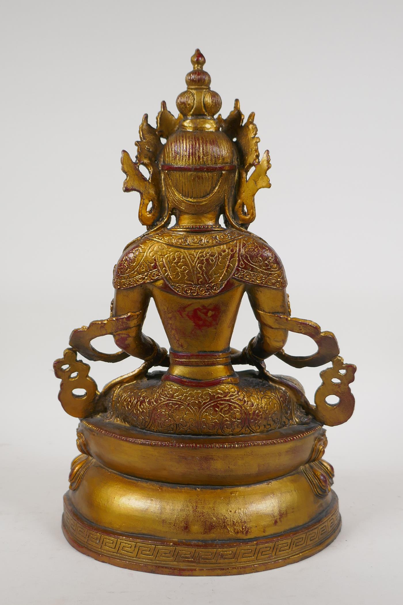 A Sino Tibetan gilt bronze figure of Buddha seated on a lotus throne, 14½" high - Image 3 of 3