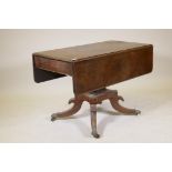 An early C19th mahogany drop leaf Pembroke table with single frieze drawer, raised on square