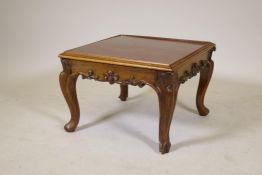 A C19th rosewood stool with carved decoration frieze, raised on cabriole supports, AF adapted with