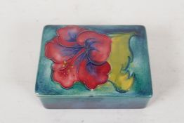 A Moorcroft pottery trinket box with fuchsia decoration, 3½" x 3" x 1½"