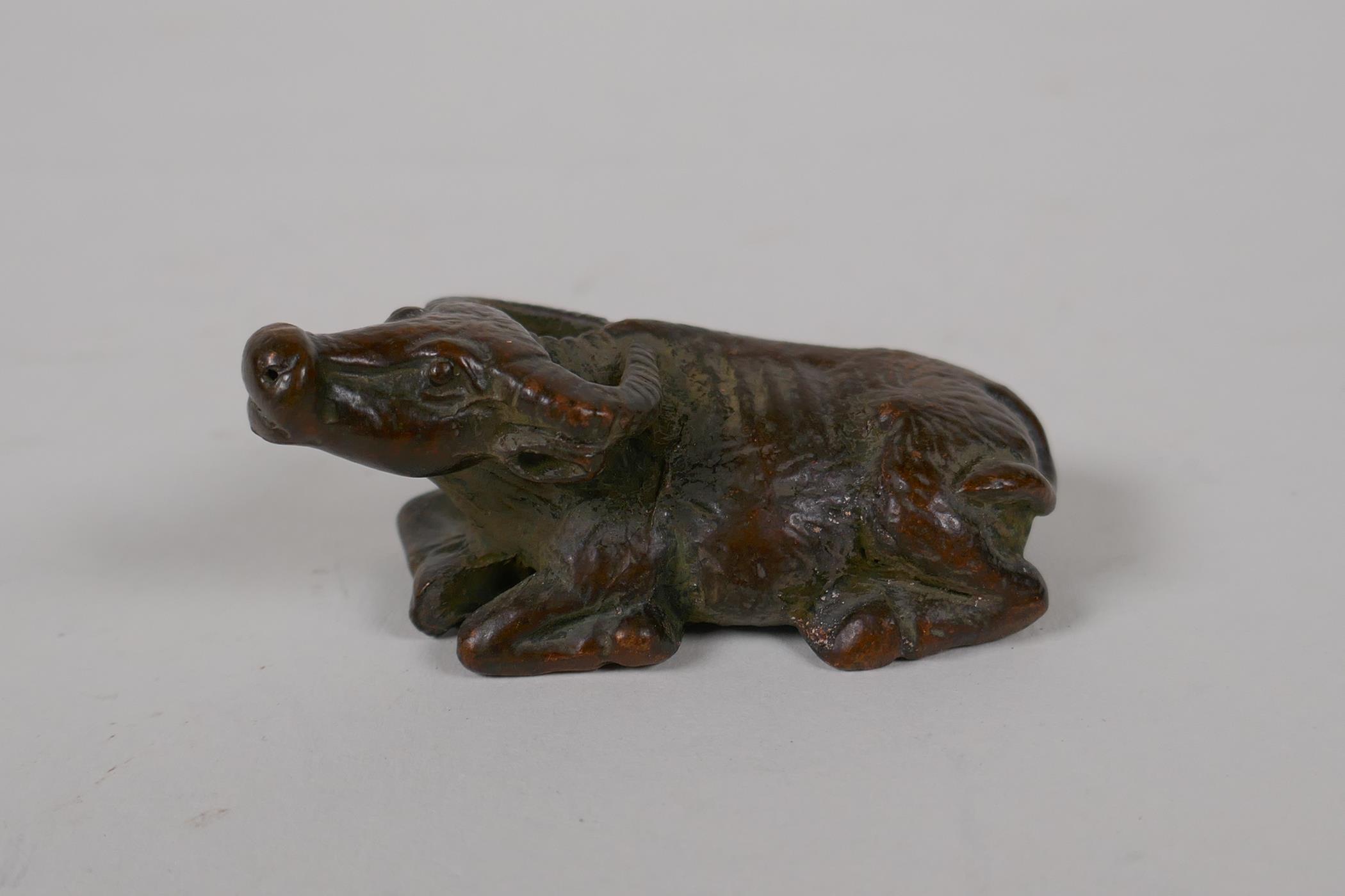 A Japanese style bronze okimono water buffalo, 2½" long