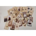 A quantity of Victorian portrait photographs, 7" x 4½"