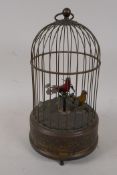 An early C20th automaton with two birds in a cage singing, 11" high
