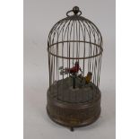 An early C20th automaton with two birds in a cage singing, 11" high