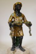 A stick stand in the form of a Blackamoor bearing a serpent, with gilt & polychrome decoration, late