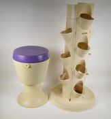 A vintage plastic plant tower and pedestal sewing box