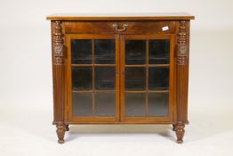 A C19th mahogany side cabinet, the crossbanded top with single drawer and two glazed doors flanked