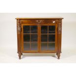 A C19th mahogany side cabinet, the crossbanded top with single drawer and two glazed doors flanked