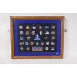 A collection of 28 NASA official astronaut crew insignia enamel badges from the Space Shuttle