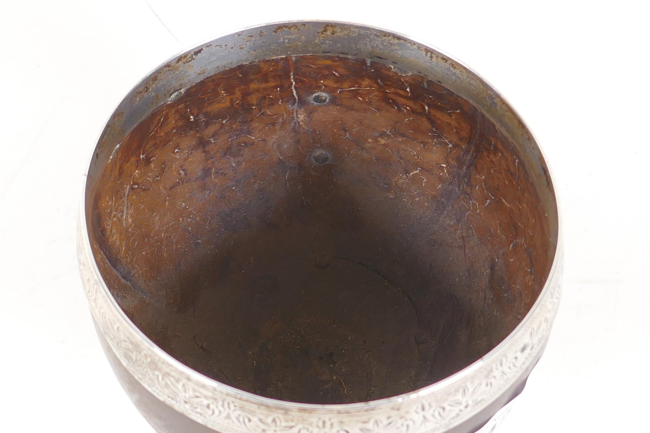 A Georgian coconut cup, with white metal mounts, the base with maker's mark, possibly William - Image 2 of 5
