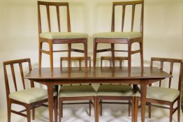 A mid century Afromosia 'Fonseca' dining table and six matching chairs with tapered back splats,