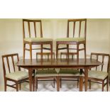 A mid century Afromosia 'Fonseca' dining table and six matching chairs with tapered back splats,