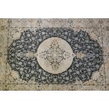 A fine woven full pile Turkish bamboo silk grey ground carpet, with floral medallion design, 93" x