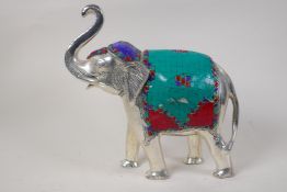 An Indian plated figure of an elephant with inlaid coloured stone costume, 12" high