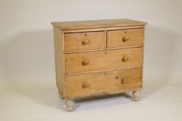 A Victorian stripped pine chest of two over two drawers, raised on turned supports, 34" x 19" x 33"
