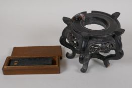 A Chinese hardwood vase stand, A/F, 4" high, and a Chinese inkstone in a wood box