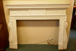 Architectural salvage, a large painted pine fire surround, with carved decoration, late C19th/early