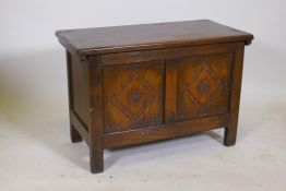 A 1930s carved oak coffer, 30" x 15" x 20" high