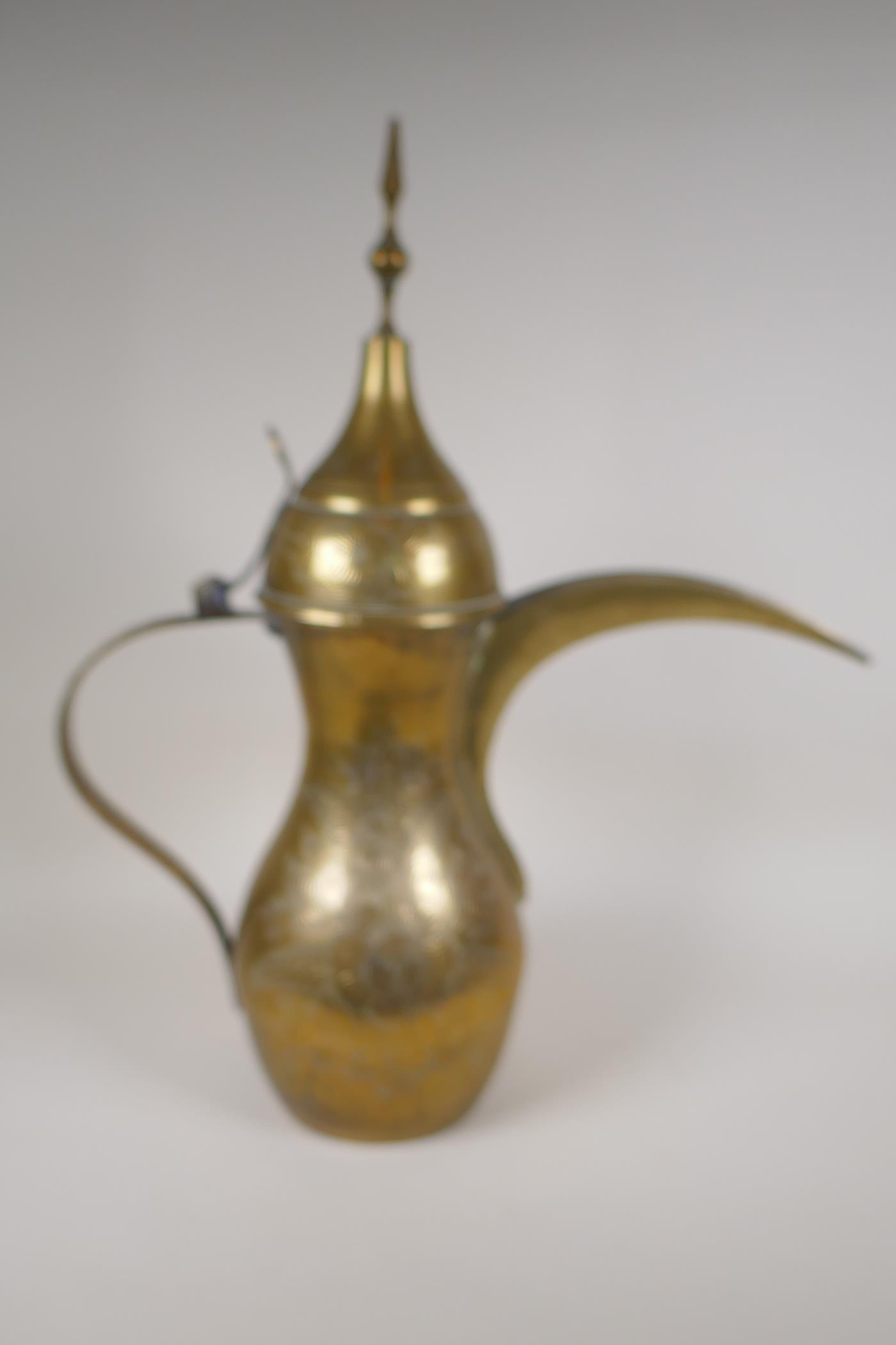 A Turkish brass coffee pot with chased floral decoration, 23½" high - Image 4 of 8