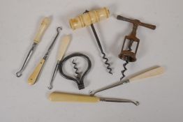 Three vintage corkscrews and five Victorian button hooks