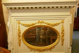 Architectural salvage, a large painted pine overmantel mirror with carved and gilded decoration, bea