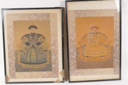 A pair of Chinese framed watercolour prints of emperors, with silk mounts, 11" x 14"