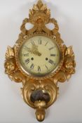 A German gilt wood FHS Cartel wall clock, the movement striking on a bell, 12½" x 20½"