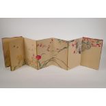A Chinese printed watercolour concertina book unfolding to make a single image of flowers, 7" x 11"