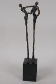A modernist bronze figure of a couple dancing, signed, on a square base, 11" high