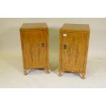 A pair of 1930s walnut bedside cupboards, raised on cabriole supports, 15" x 15" x 27"