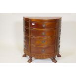 A hardwood demi lune chest, with parquetry sunburst inlaid top and twelve drawers, raised on paw