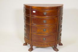 A hardwood demi lune chest, with parquetry sunburst inlaid top and twelve drawers, raised on paw