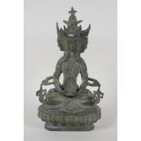 A Sino Tibetan bronze figure of a many faced Buddha, 8½" high
