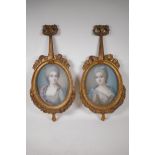 A pair of C19th pastels, women in C18th costume, signed Laurie (?), in carved giltwood frames, 10" x