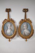 A pair of C19th pastels, women in C18th costume, signed Laurie (?), in carved giltwood frames, 10" x