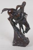 After Remmington, a bronze figure of a North American Native hunter on horseback, 9½" high