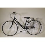 A Claude Butler 6061 Stepthrough bike with an aluminium frame, 27" wheels