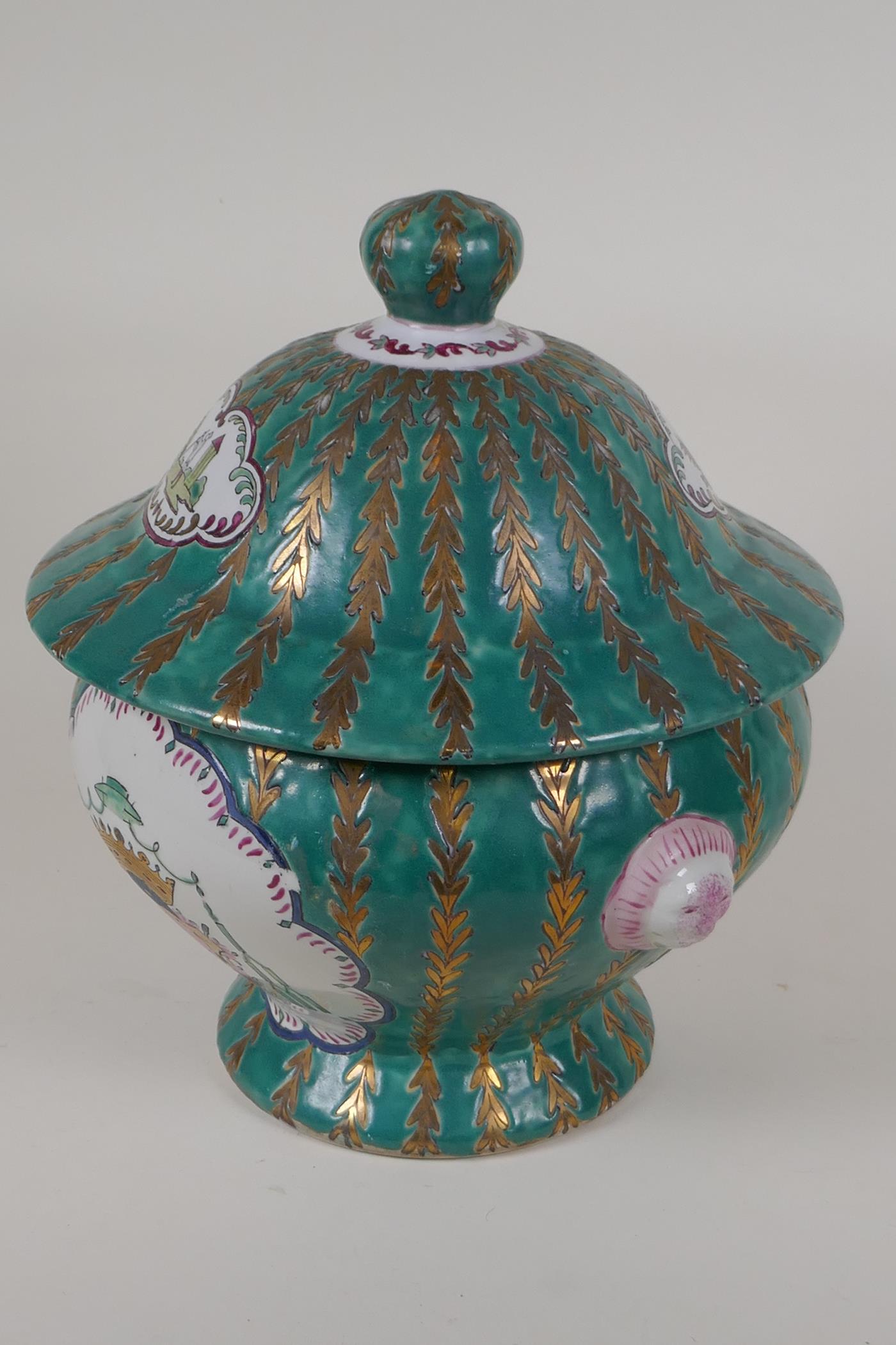 A Continental porcelain jar and cover with panels decorated with coats of arms, on a green and - Image 2 of 4