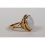 A 9ct yellow gold and opal set ring, size L/M