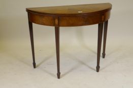 A Georgian mahogany demi lune tea table, with well figured matched veneered top, inlaid decoration