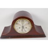 A 1930s Napoleon's hat mahogany cased mantel clock with striking movement