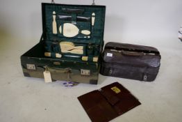 A vintage vanity case with canvas cover and fitted interior, (incomplete), bears maker's label