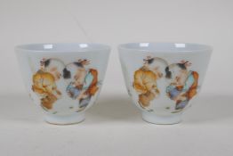 A pair of Chinese Republic period porcelain tea bowls decorated with boys playing marbles, 4