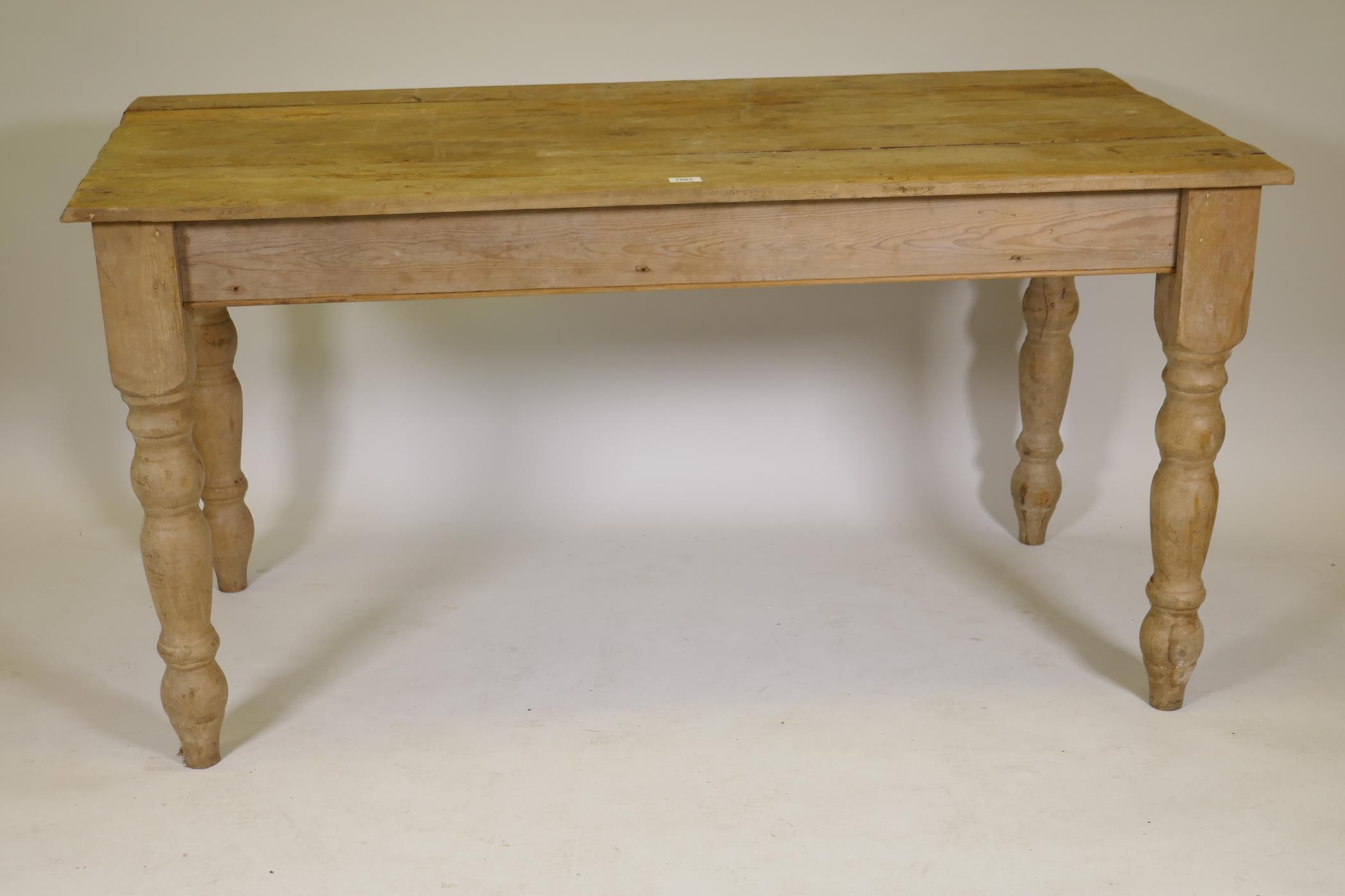 A pine scullery table with planked top, 58" x 30" x 30"